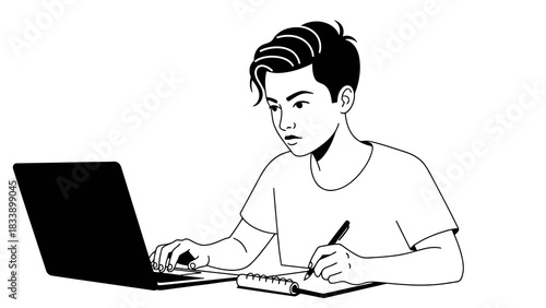 Focused young person working on laptop and taking notes