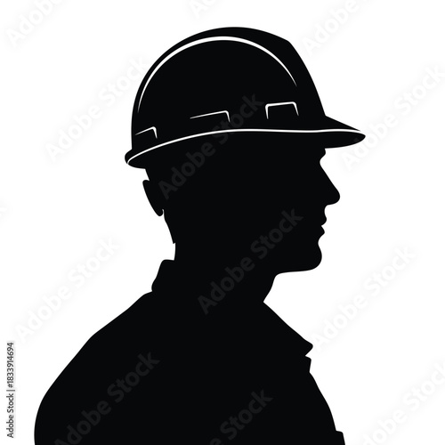 Silhouette of construction worker wearing hard hat