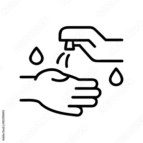 Hand washing with soap from dispenser and water droplets falling  