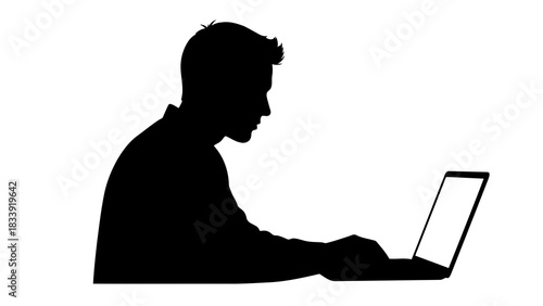 Silhouette of a man working on a laptop computer