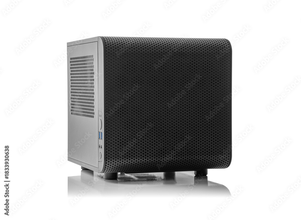 Obraz premium A black, compact mini-ITX computer case with a mesh front panel, isolated on a white background with a subtle reflection.
