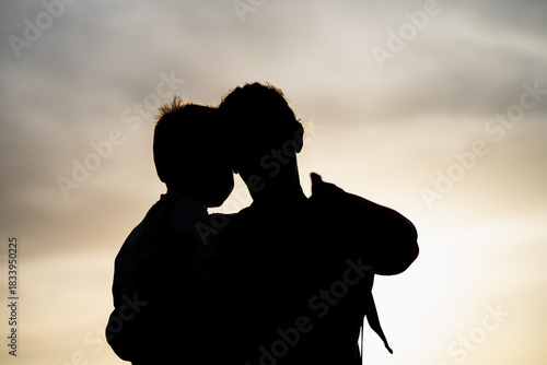 Mother carrying son pointing direction in nature