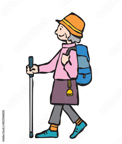 熊よけの鈴をつけて登山をする女性（シニア）