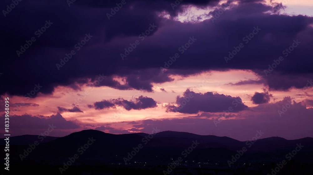 Obraz premium midgard. Dark purple storm clouds gathering before rainfall, dramatic sky formation, natural weather phenomenon. travel magazines, destination branding, designed for travel destination branding.