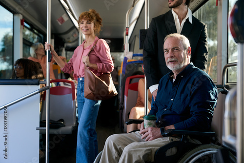 Senior man using wheelchair on public bus