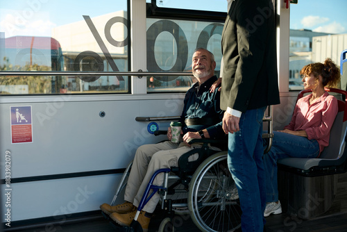 Senior man in wheelchair traveling on public bus