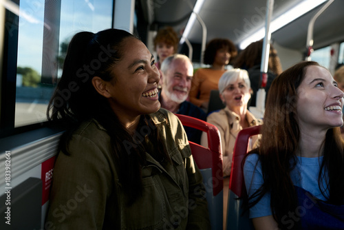 Diverse passengers enjoying a cheerful bus journey