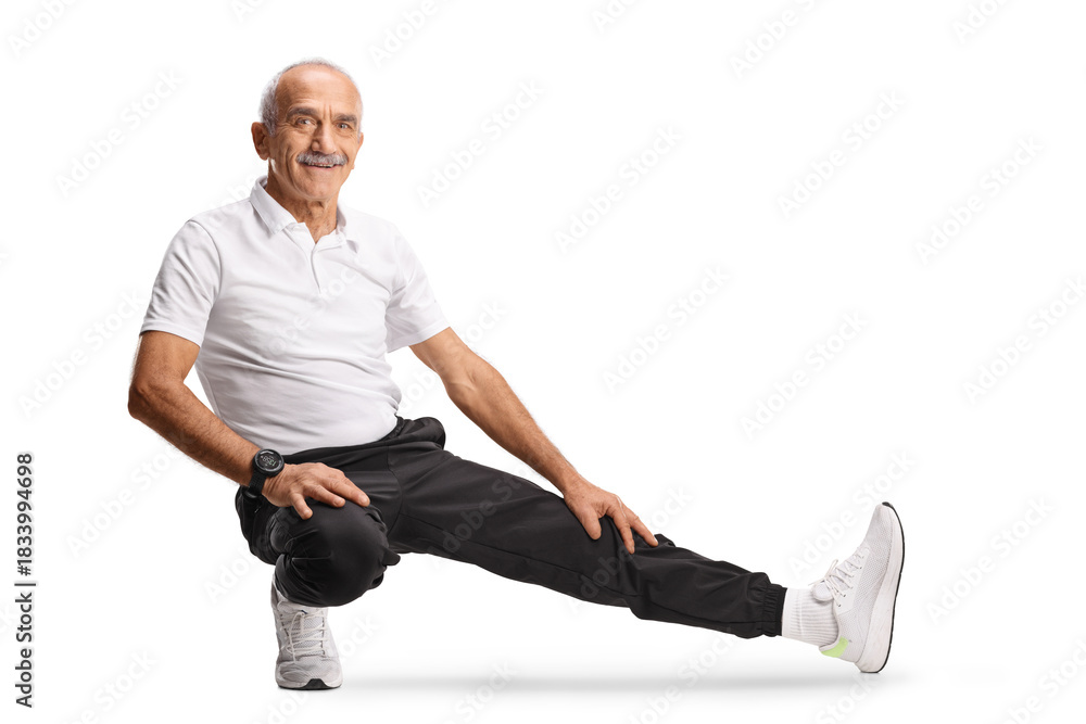 Obraz premium Mature man in sportswear stretching leg
