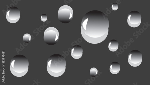 Glossy grey water-drop bubbles on a dark background. Smooth reflective spheres with soft highlights creating a modern abstract pattern.