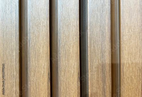 Wooden wall with vertical grooves pattern texture background.