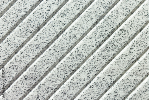 Recycle material finishing wall with vertical grooves 45 degree pattern texture background.