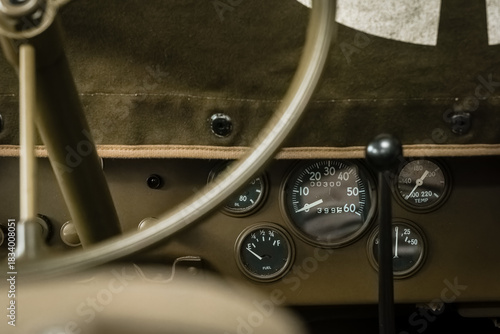 Vintage vehicle dashboard showcases classic gauges and timeless design in a nostalgic setting