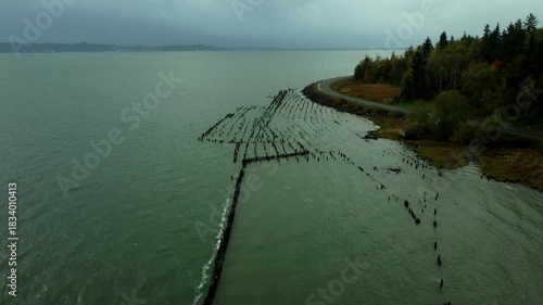 Wallpaper Mural US, WA, Chinook, 2025-10-25 - Drone view of old dock pilings along the Columbia River just before a storm Torontodigital.ca