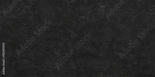 A dark gray asphalt texture background with a rough black stone pattern and a weathered vintage grunge surface creates a blank material design for a textured wall wallpaper or canvas