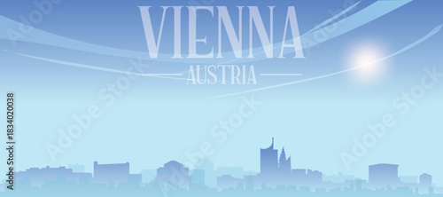 Blue panoramic poster of the city skyline with misty background buildings and clouds of VIENNA, AUSTRIA
