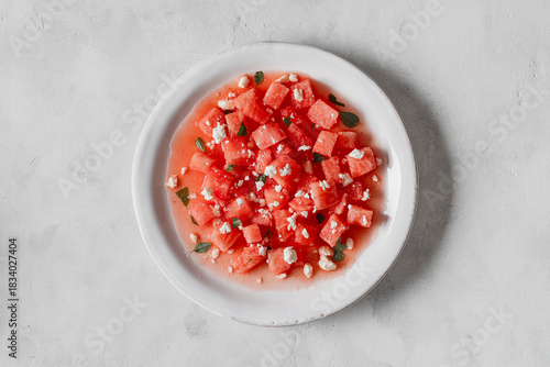 Salad made with watermelon, feta, and mint leaves.
