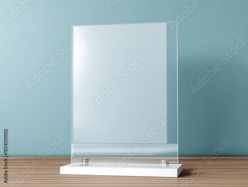 There is a mock-up of a stand made of transparent acrylic glass on the table. A template for a display, nameplate, and signage for a card design idea.