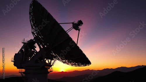 Dynamic satellite dish tracking the horizon at dusk as it monitors space signals and discovers new frontiers in a vibrant twilight landscape