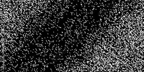 Dense Black and White Granular Texture with Varied Light Distribution.