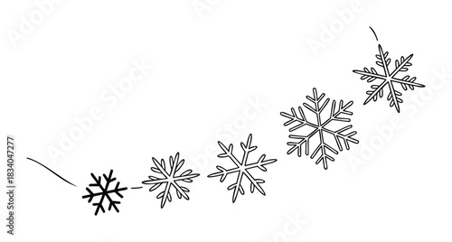 Delicate snowflakes falling in a gentle arc, suggesting winter weather and holiday themes for seasonal decoration and celebration projects.