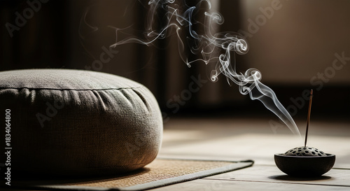 Zen Meditation Cushion and Incense Smoke in Soft Light image photo