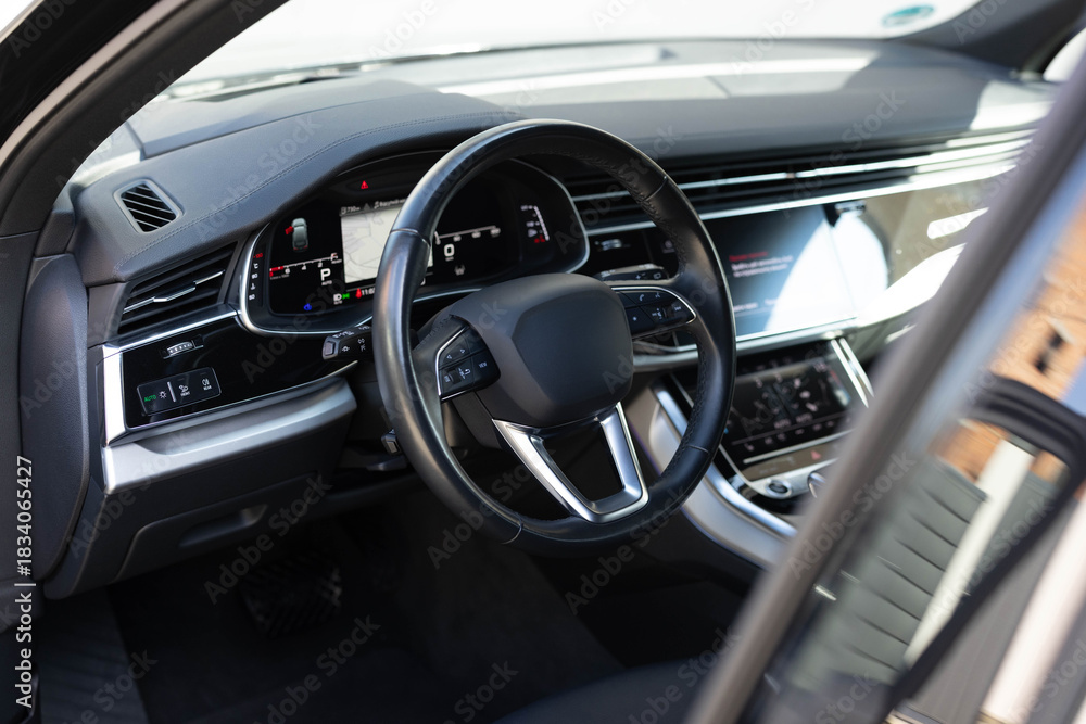 Naklejka premium Empty cockpit electric diesel hybrid vehicle, Head Up Display and digital speedometer. Steering wheel of electric vehicle cockpit electric buttons. Autonomous car. Driverless car. Self-driving vehicle