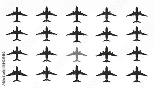 A grid of black airplane silhouettes with one grey airplane standing out in the middle, symbolizing uniqueness.