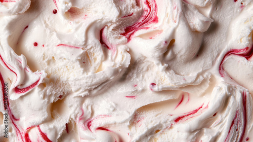 Creamy white ice cream with red swirls and dots image