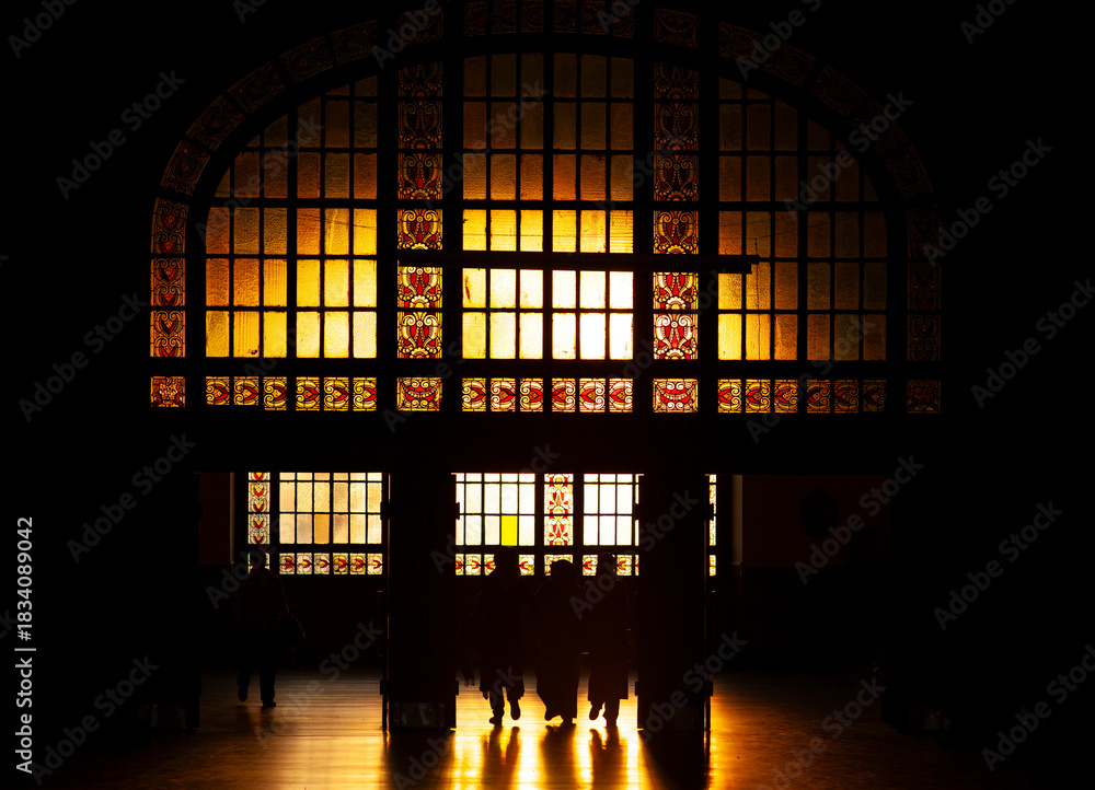 Fototapeta premium Kadıköy, Istanbul, Türkiye. The entrance of the historic Haydarpasa train station at sunset