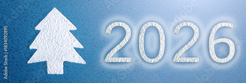 Christmas Tree from Snow on blue background. Happy New Year 2026 Background. Holiday, Winter, Card, Congratulation. Panoramic banner.