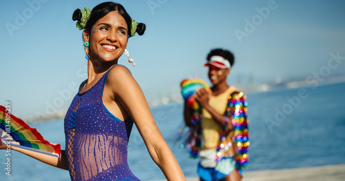 Fotografie Carnival dancers at a sunny beach celebration