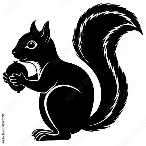 Black silhouette of a squirrel holding an acorn with a bushy tail