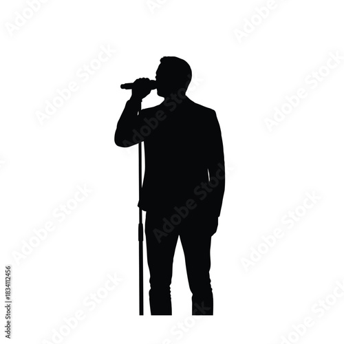 Singer performing into microphone silhouette