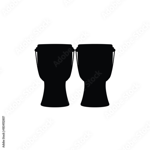 Two black bongo drums in silhouette