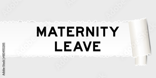 Ripped gray paper background that have word maternity leave under torn part