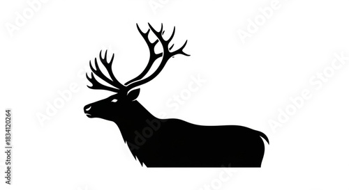Majestic black silhouette of a stag with large antlers standing proudly against a clean white background symbolizing nature and wild animals