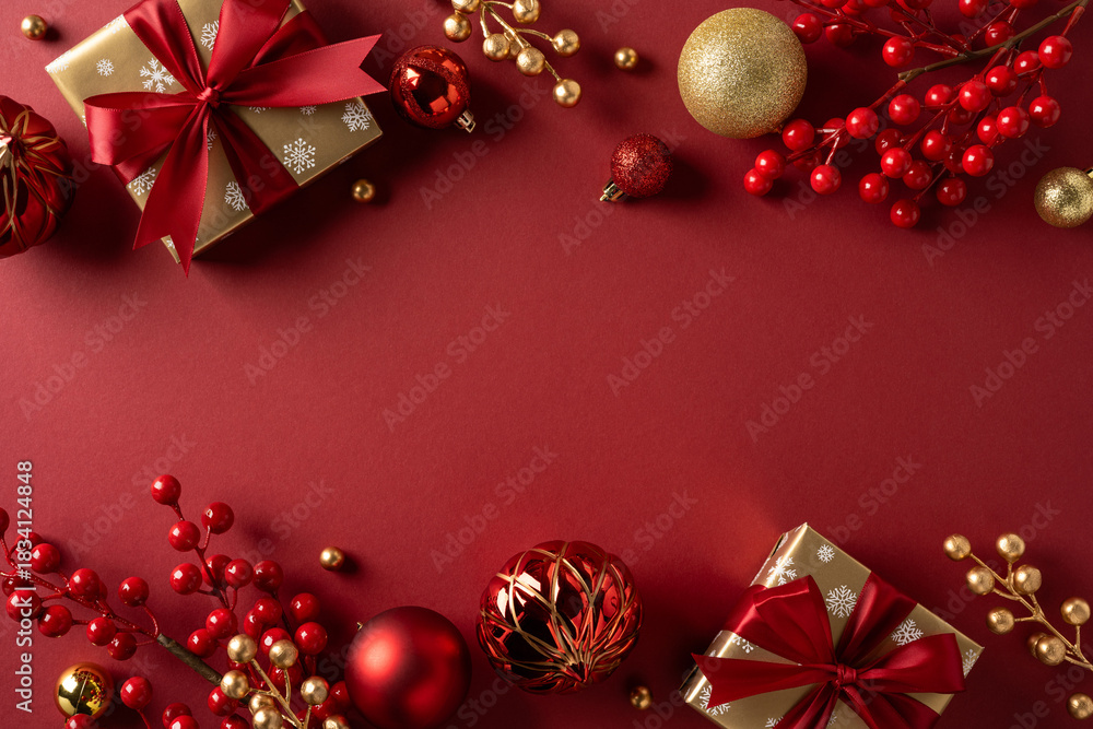 Fototapeta premium A festive scene featuring wrapped gifts, red ribbons, gold ornaments, and red berries on a deep red backdrop, perfect for Christmas and New Year greetings and seasonal promotions