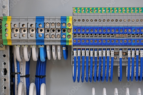 Electrical screw terminals for connecting wires in an electrical switchboard. Soft focus. Close-up.