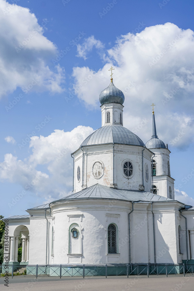 Fototapeta premium Historic Orthodox church and bell tower in Ostrov, Pskov oblast, Russia, an old Russian city. stock photo 