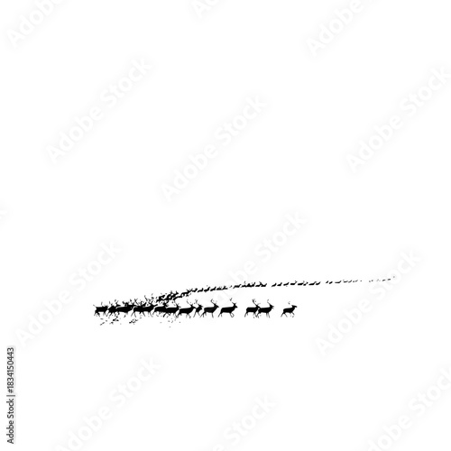 Silhouette of a large herd of reindeer migrating across a snowy landscape in a long single file line formation