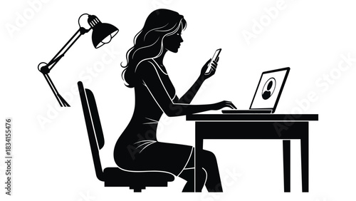 Silhouette of woman using laptop and phone with lamp on the desk chair