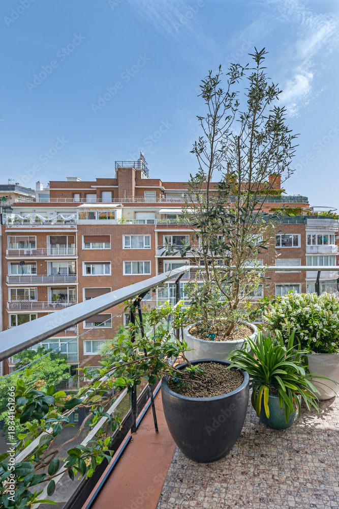 Fototapeta premium Zen terrace with a rock garden, bamboo fountain, and meditation space amidst the urban bustle