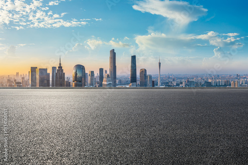 Empty asphalt road and city skyline with modern buildings scenery at sunrise in Guangzhou