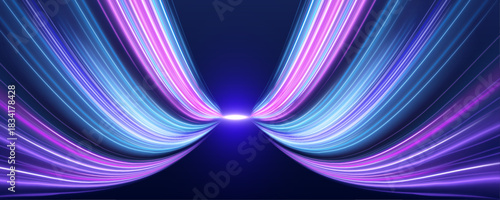 Futuristic neon trails light up dark city highways. Bright blue beams highlight the speed of motion. Perfect for abstract tech and racing concepts. 