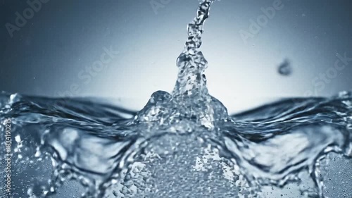 Closeup of water splashing with bubbles and condensation