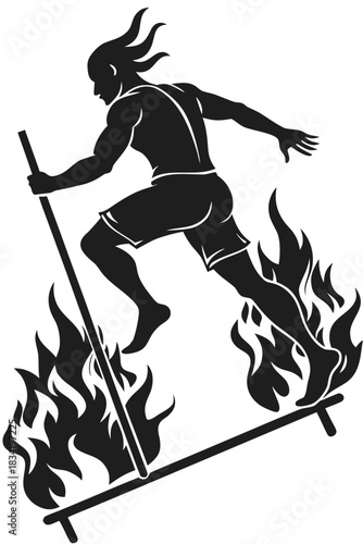 Silhouette of a man running barefoot across a fire walk with a pole for balance