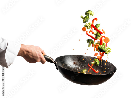 Chef hand tossing vegetables stir fry frying pan isolated white background png transparent cutout cooking healthy food vegan vegetarian broccoli pepper carrot motion action culinary studio shot 