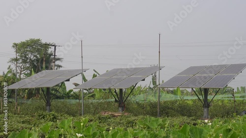Solar panels installed in a field, for agricultural powering an irrigation purpose