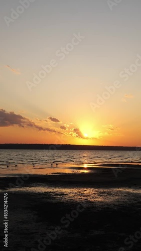  Beautiful golden sunset over a calm lake or sea
