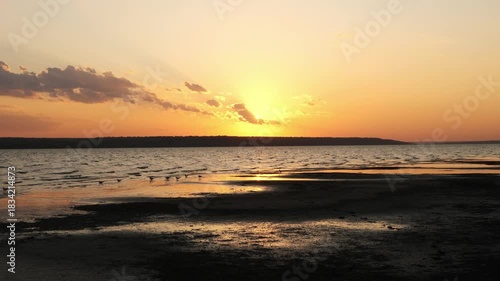 Beautiful golden sunset over a calm lake or sea